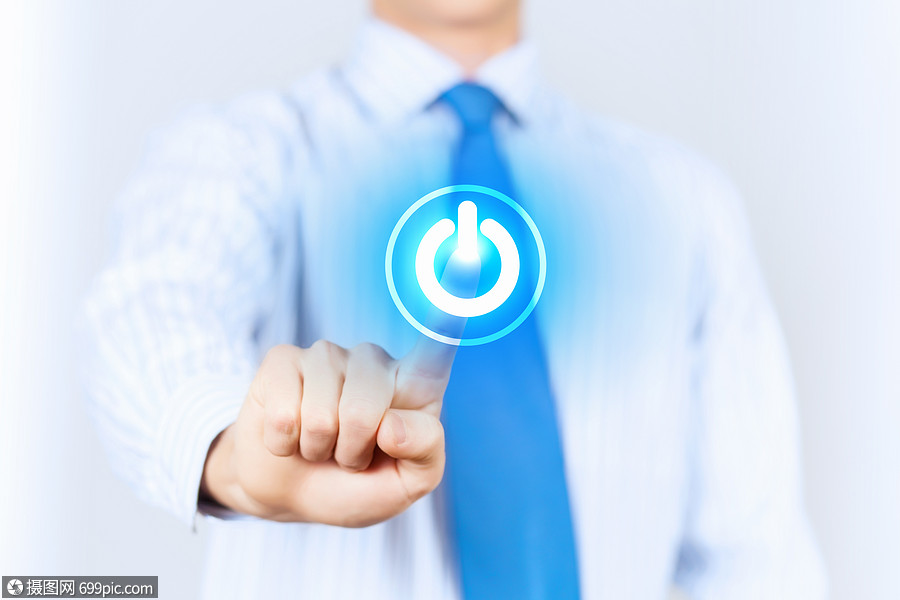 电源按钮穿着浅色衬衫蓝色领带的轻人按下电源按钮场的浅深度触摸商人