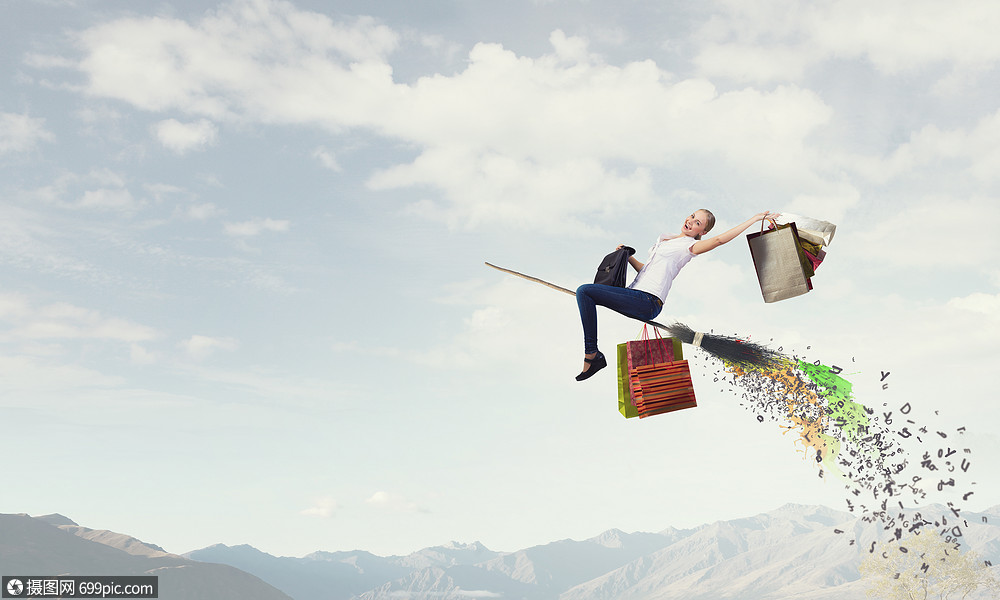 女孩乘扫帚飞快乐的轻女人扫帚上飞翔飞行幸福的