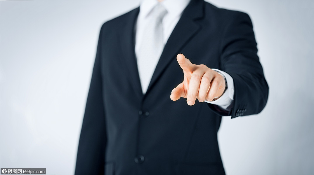 人商业手势的近距离的人指着某物