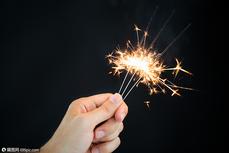 诞节,假日,新派烟火男手火花孟加拉灯燃烧黑色背景