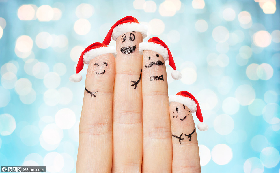 节身体部位的用四根手指诞老人的帽子上靠近手,蓝色的灯光背景上笑脸