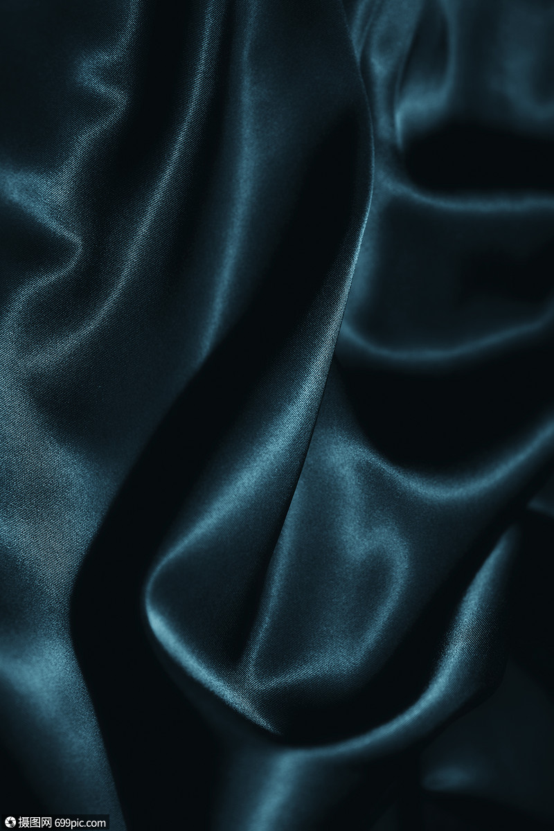 深蓝色丝绸的纹理特写纺品光泽