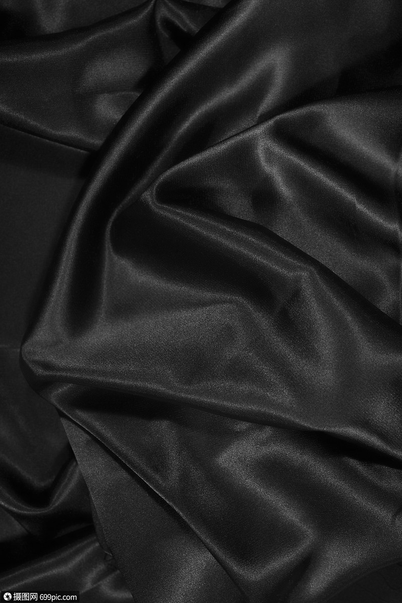 纹理的黑色缎子丝绸极端接近闪亮的亚麻布