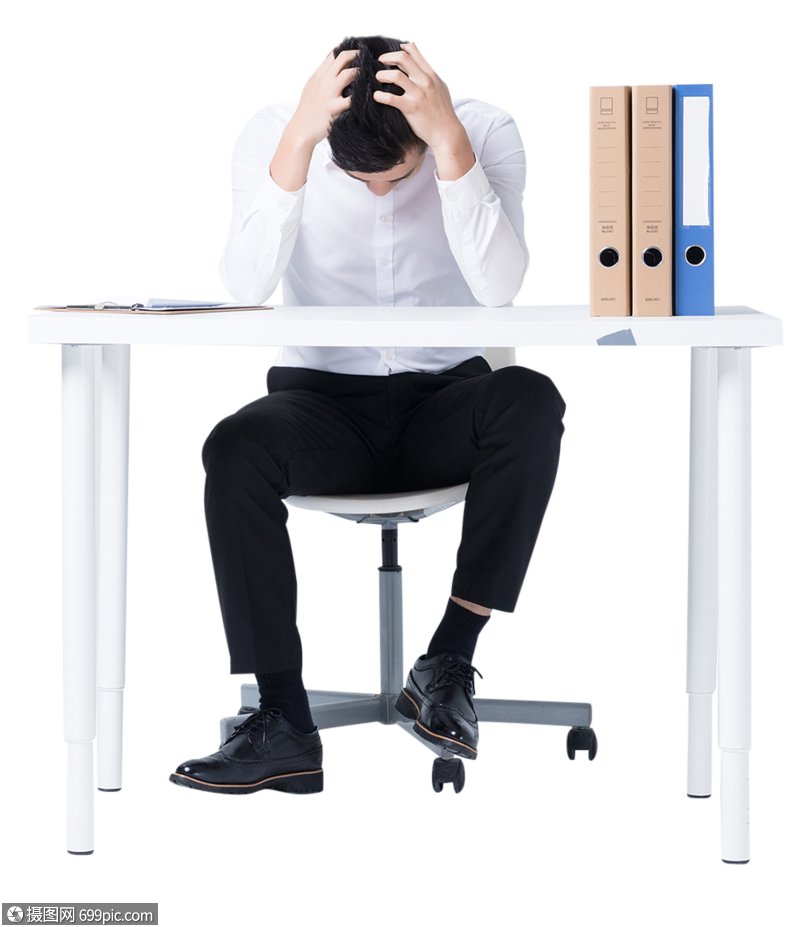 坐在办公桌前低头沮丧的商务白领图片