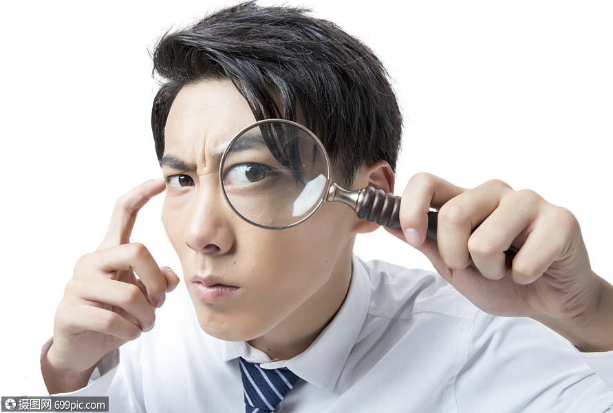 商务男性手拿放大镜观察