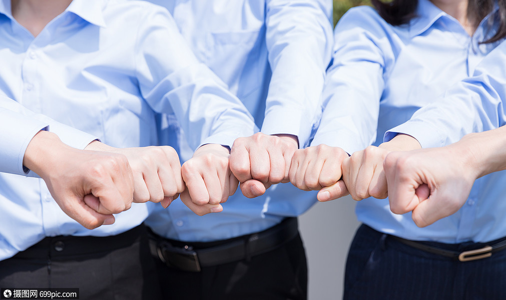 企业团队握拳团结特写职员团体