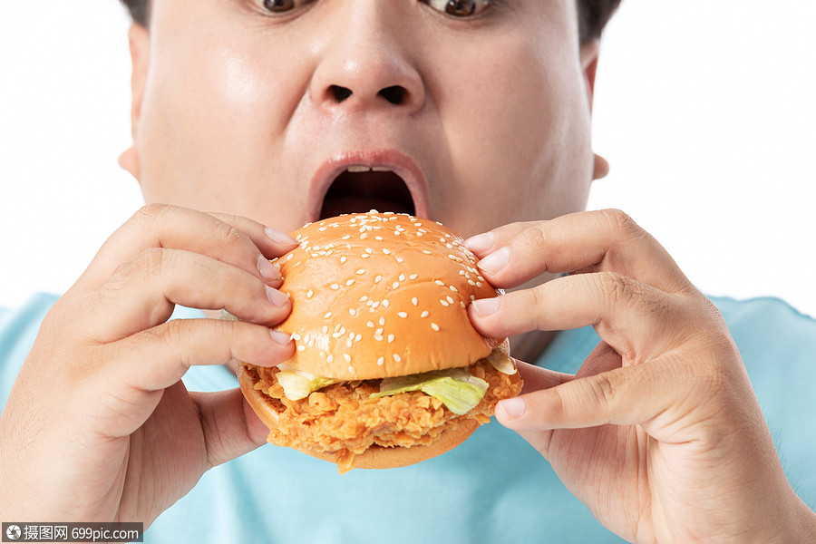肥胖男士大口吃汉堡青年男生