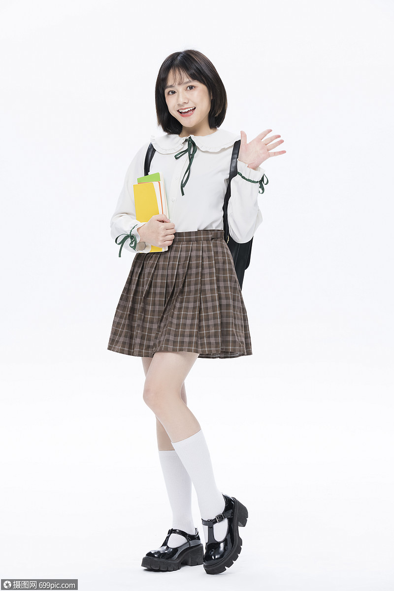 青春活力大学生手捧书本打招呼